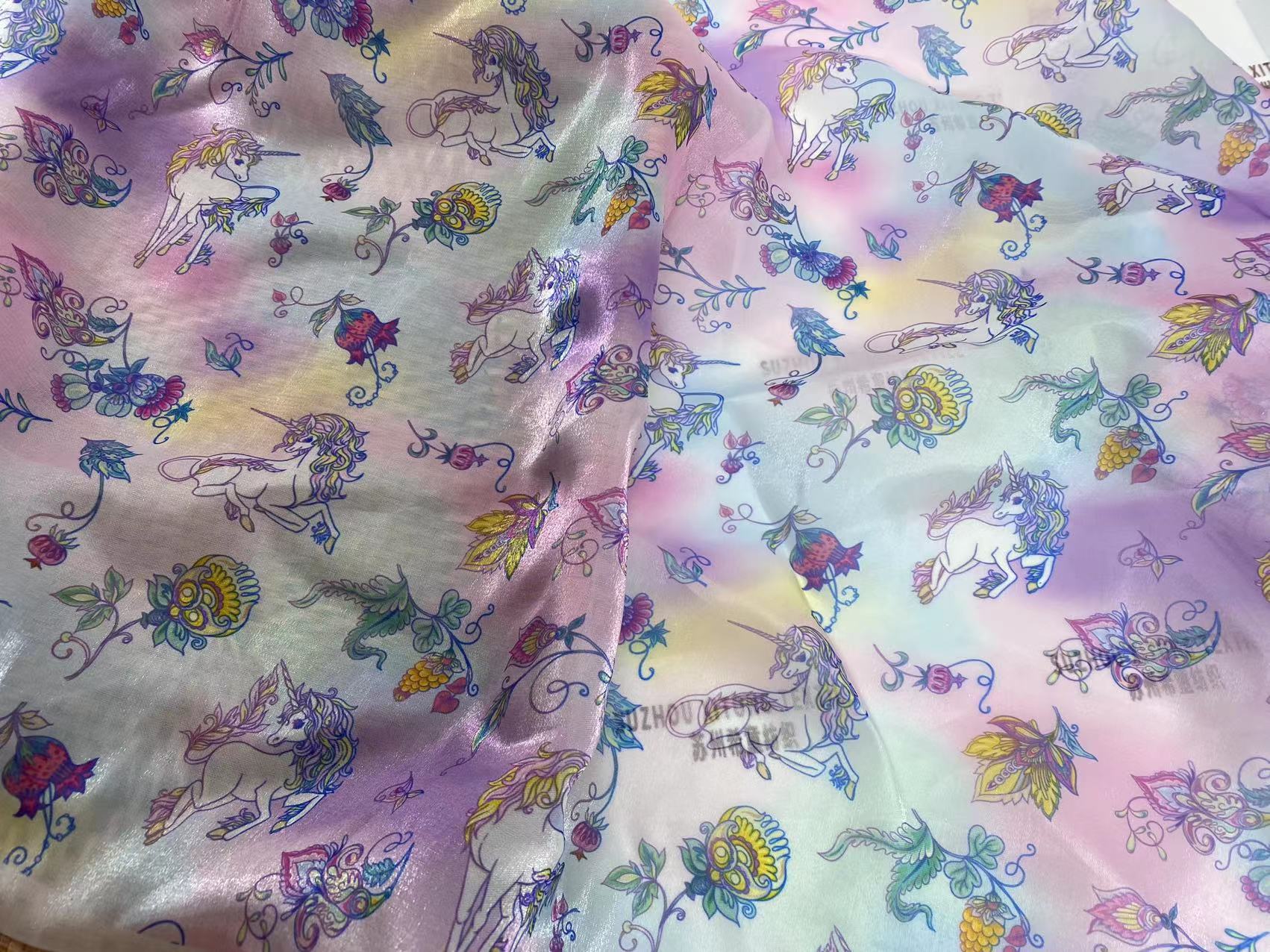 Hot selling polyester soft shiny cute design rainbow background liquid organza fabric for kids dress