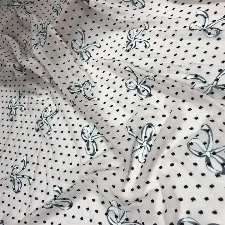 Spring and summer new girl bow printed fabric 100% polyester fabric woven jacquard chiffon black dot fabric